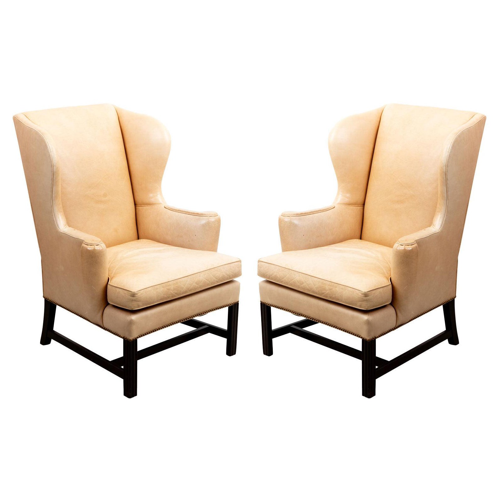 Pair of Cowtan and Tout Camel Leather Wing Chairs