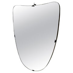 Italian mid-century modern wall mirror rounded shield shape brass details, 1960s