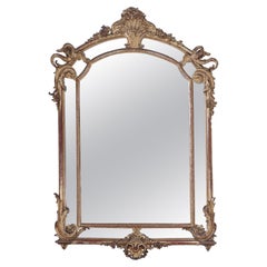 Large gilt mirror with serpents and great original surface C 1900.
