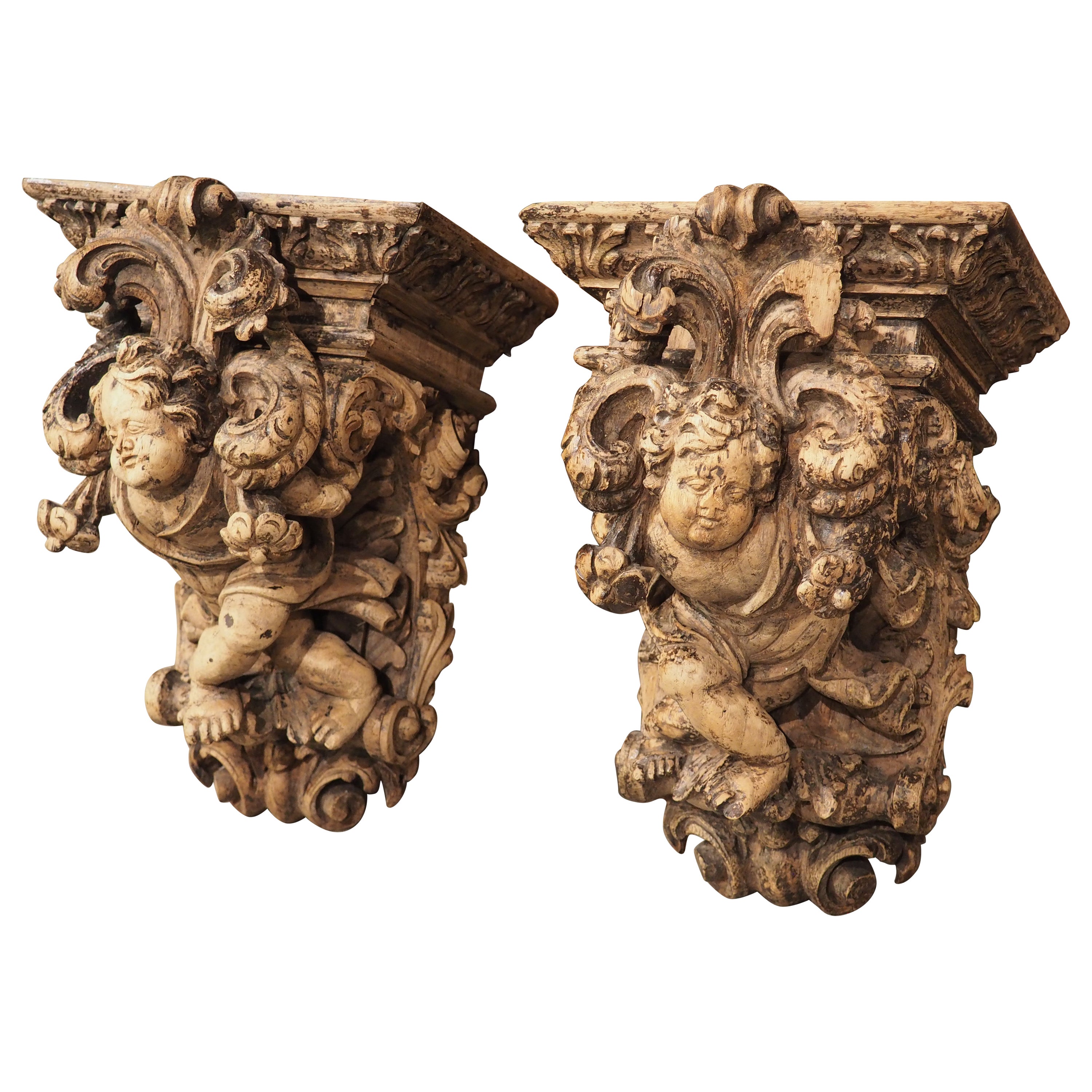 Pair of Highly Carved Partially Stripped French Oak Cherub Brackets, C. 1850 For Sale