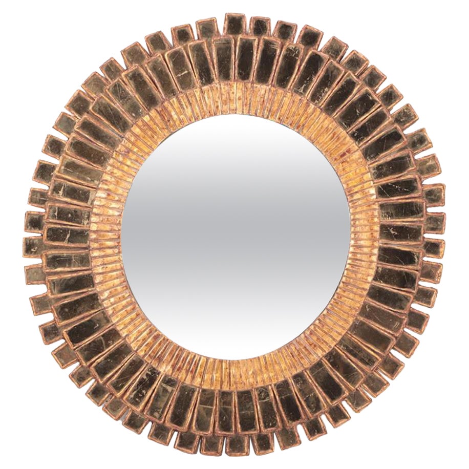 Gold Glass and resin sunburst mirror in the manner of Line Vautrin
