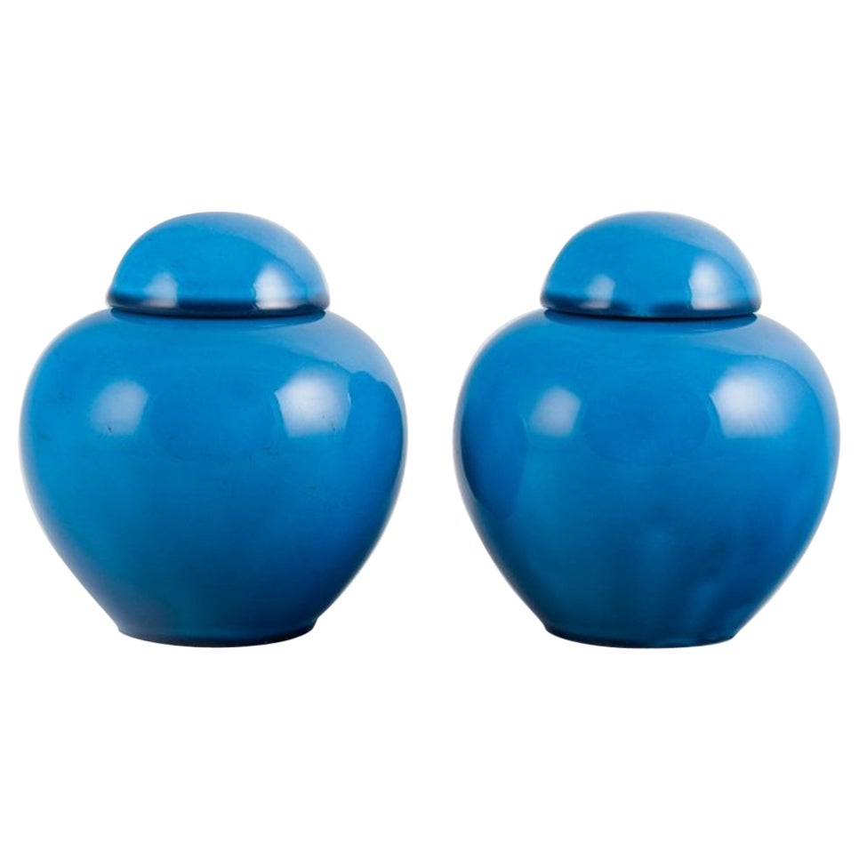 French ceramicist, a pair of lidded jars in turquoise glaze. Mid-20th century.