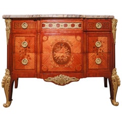 A  19th c French marquetry and gilt bronze mounted commode signed Henri Picard