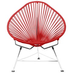 Innit Designs fauteuil Acapulco tissé rouge sur cadre chromé