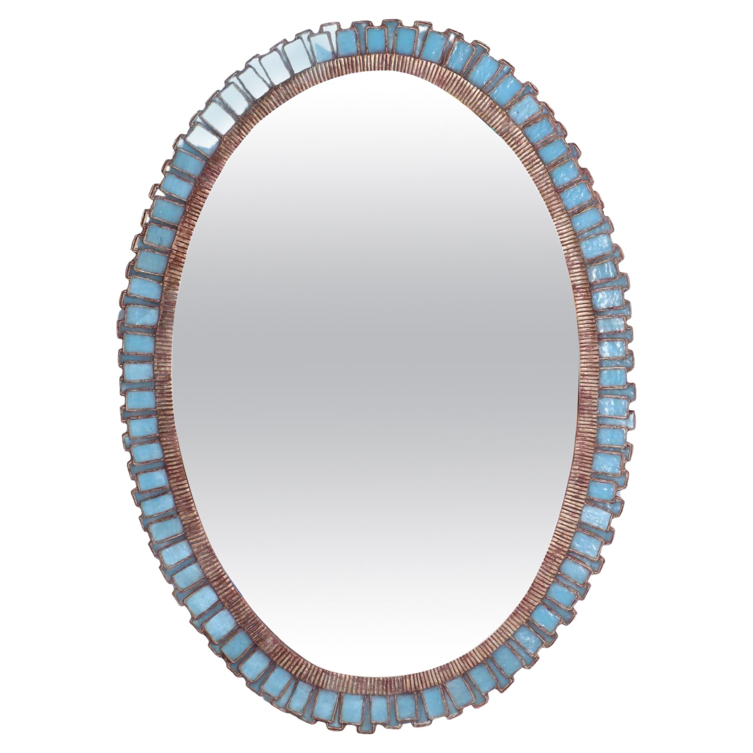 An oval mirror made of gilt resin and blue glass in the manner of Line Vautrin.  For Sale