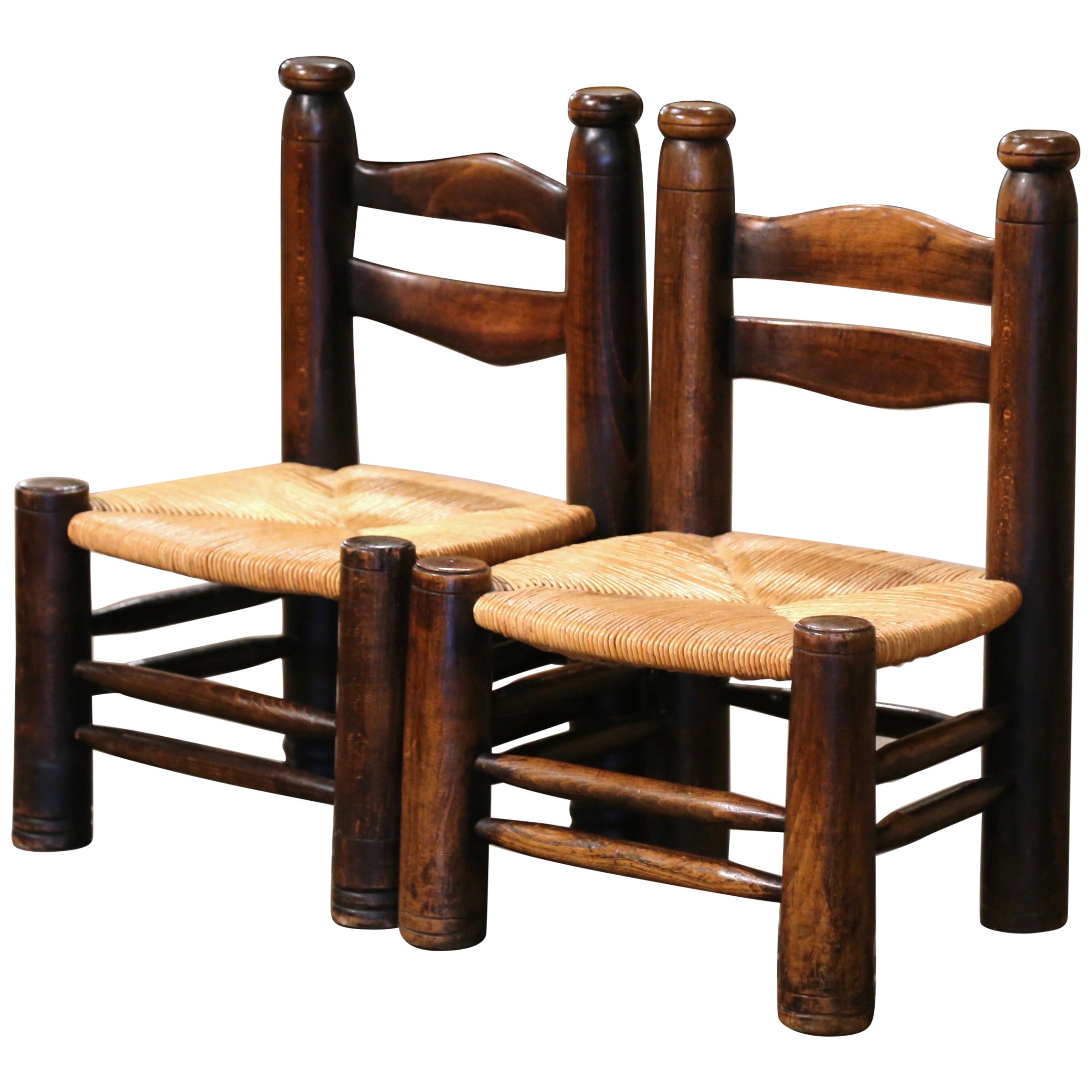 Pair of Early 20th Century French Carved Walnut and Rush Seat Low Chairs For Sale