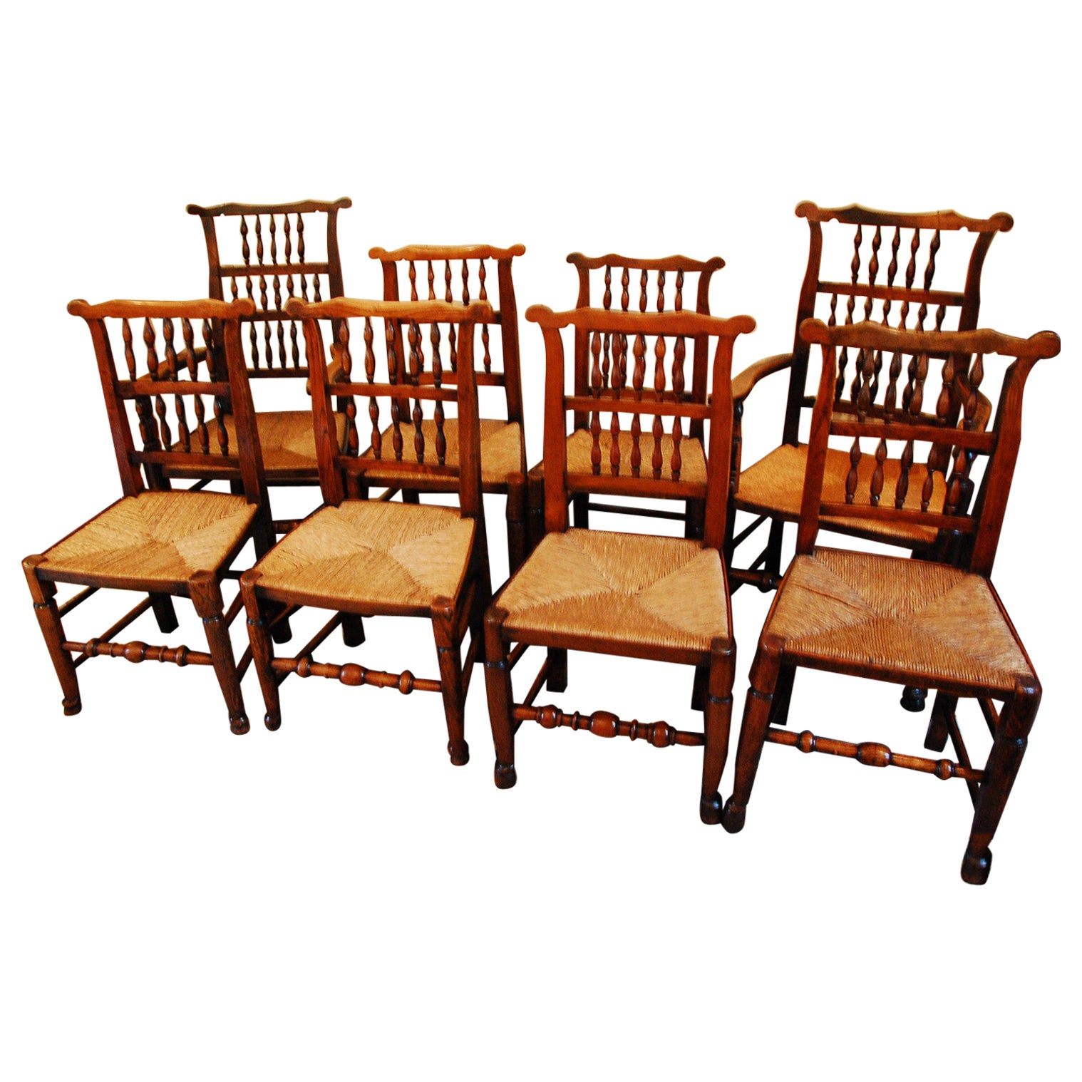 English Set of Eight  Elm Spindleback Chairs Early 19th C Two Arms and Six Sides For Sale