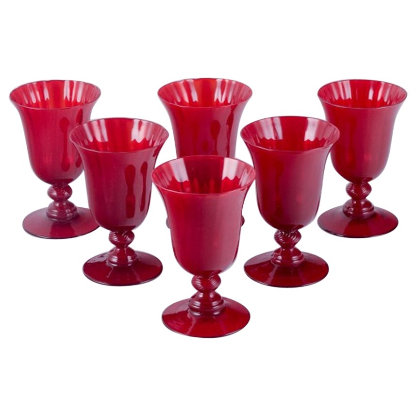 A set of six large wine glasses in red glass. Sweden. For Sale