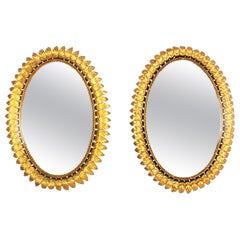 Pair of Sunburst Oval Mirrors in Gilt Metal