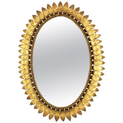 1950s Sunburst Oval Mirror in Gilt Metal