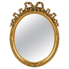 Miroir ovale français ancien du 19ème siècle à feuilles d'or et doré Louis Seize 