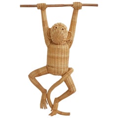Handmade Wicker Jumpsuit Attached to a Wooden Branch 