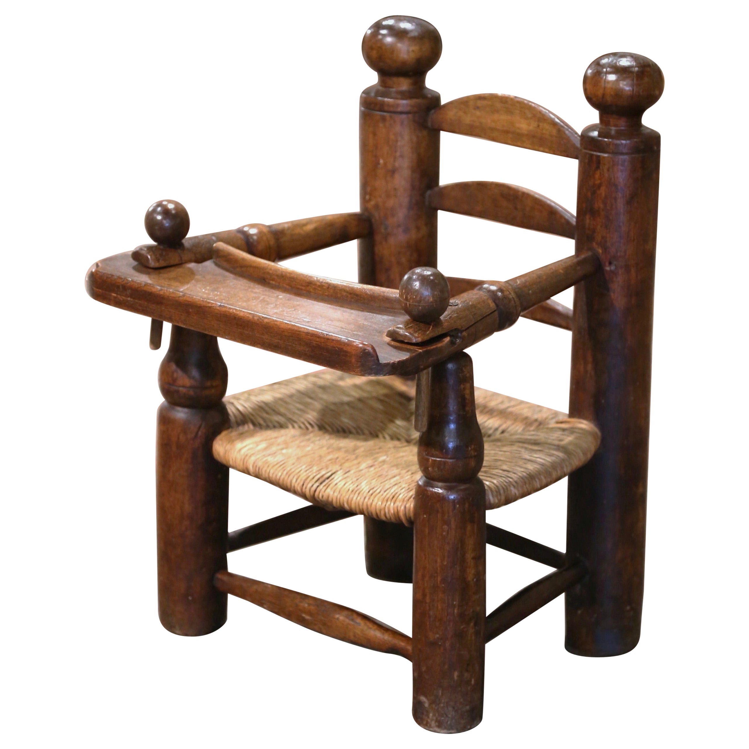 19th Century French Normandy Carved Oak Child Feeding Chair with Rush Seat  For Sale