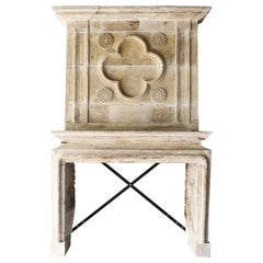 18th century castle fireplace of french limestone with trumeau Louis XIV