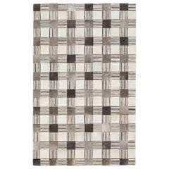 Tapis contemporain en cuir et laine dans des tons terreux