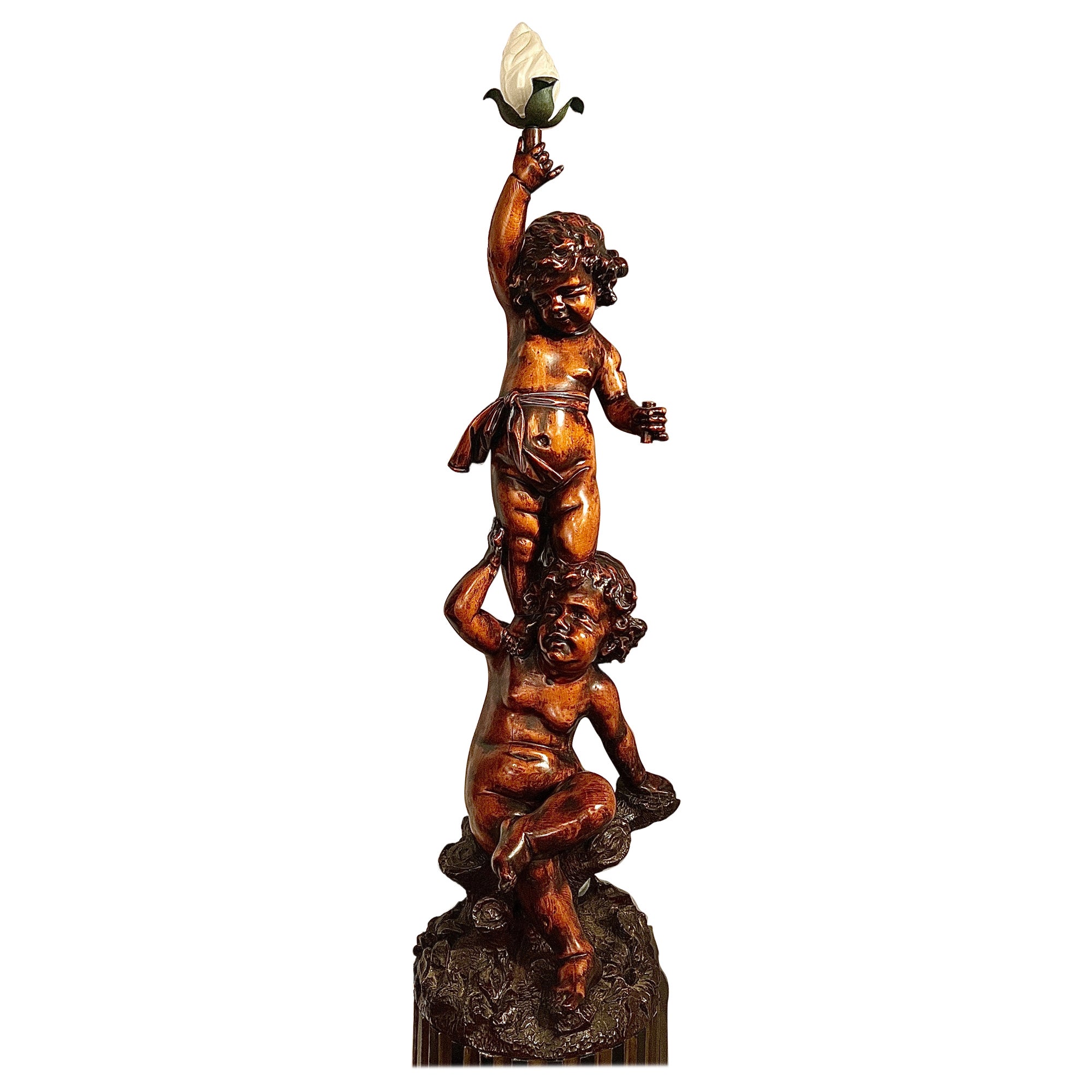 Estate Carved Wood Figurines Upholding a Torch, Circa 1950. For Sale