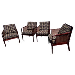 A set of 2 Vintage Faux Bamboo Mahogany and Cane Arm Chairs