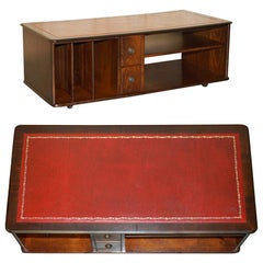 Used OXBLOOD LEATHER AND FLAMED HARDWOOD COFFEE TABLE PART OF LARGE SUITE