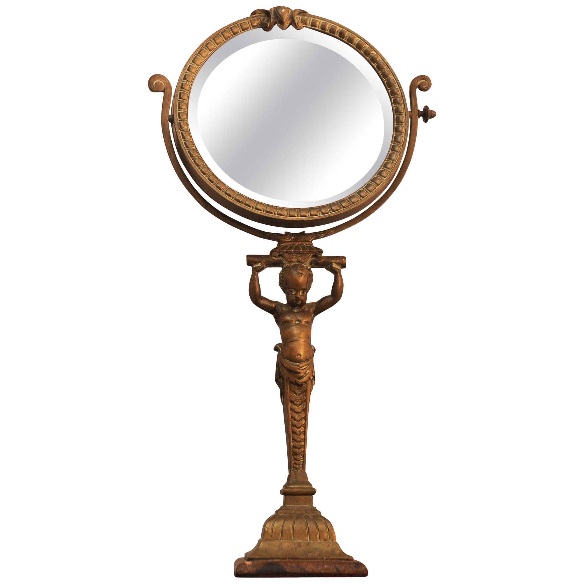 A Rare Regency Cherubic Brass Revolving Vanity Mirror  For Sale