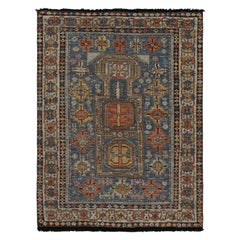 Rug & Kilim’s Tribal Style Rug in Blue, with Red and Gold Geometric Patterns