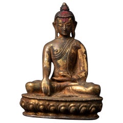 19th century antique bronze Nepali Buddha statue in Bhumisparsha Mudra
