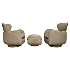 Pair of Vladimir Kagan Rocking Swivel Chairs and Ottoman
