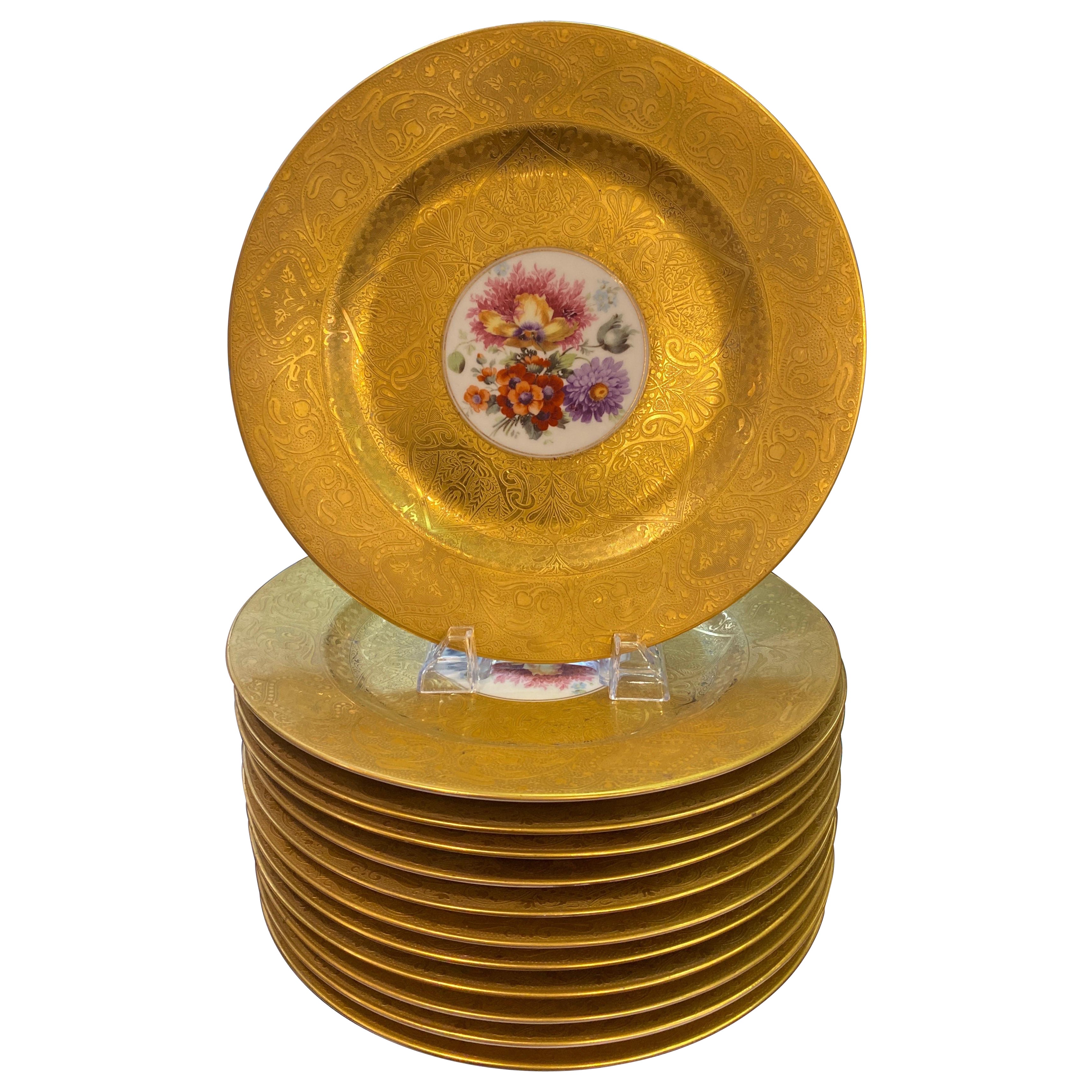 An opulent set of 12 gold encrusted floral service plates For Sale