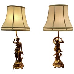 A Pair of French Figural Brass Lamps, after Ernest Justin Ferrand  A Pair of Fre