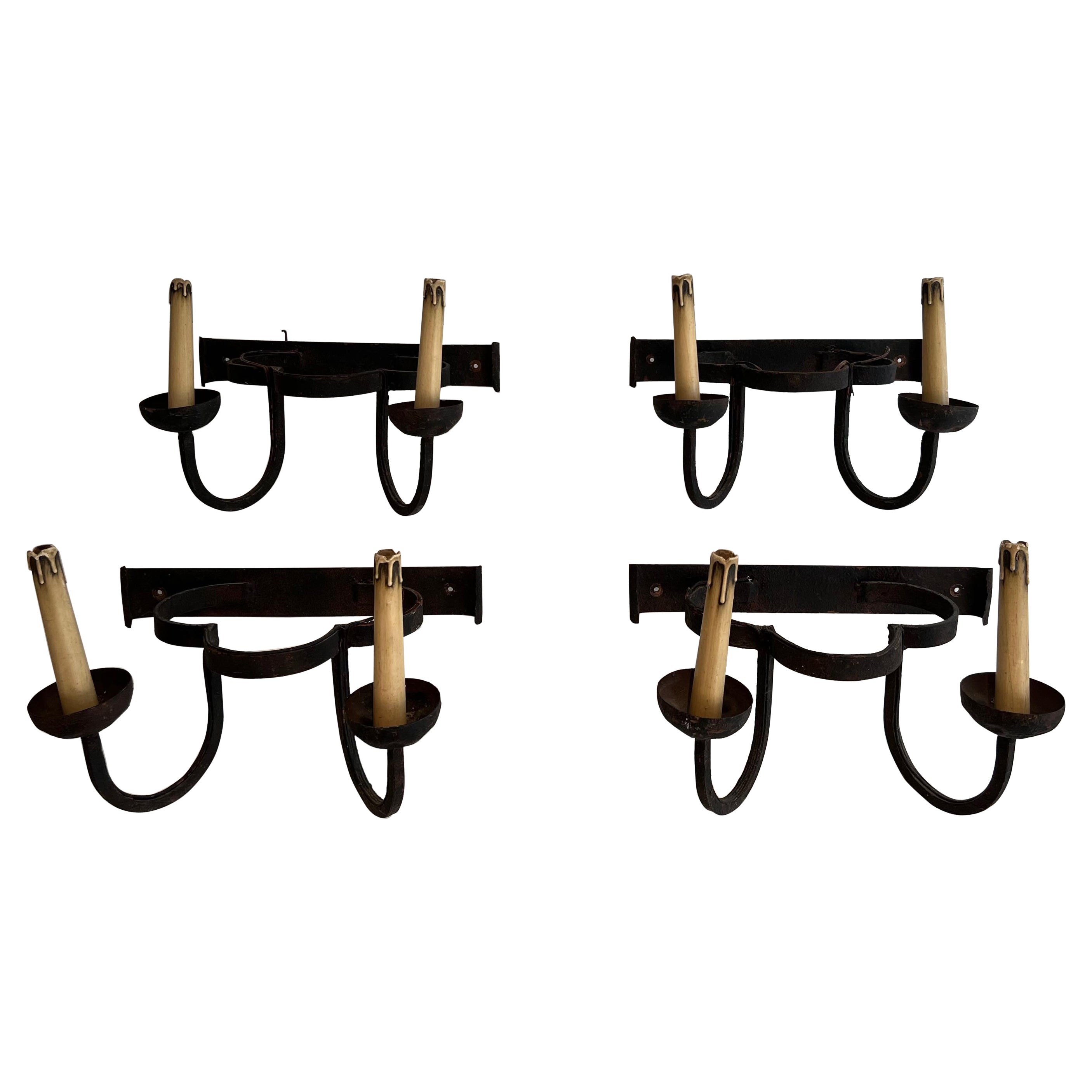 Set of 4 clover wrought iron wall lights. French work. Circa 1950 For Sale