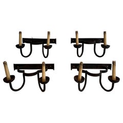 Set of 4 clover wrought iron wall lights. French work. Circa 1950