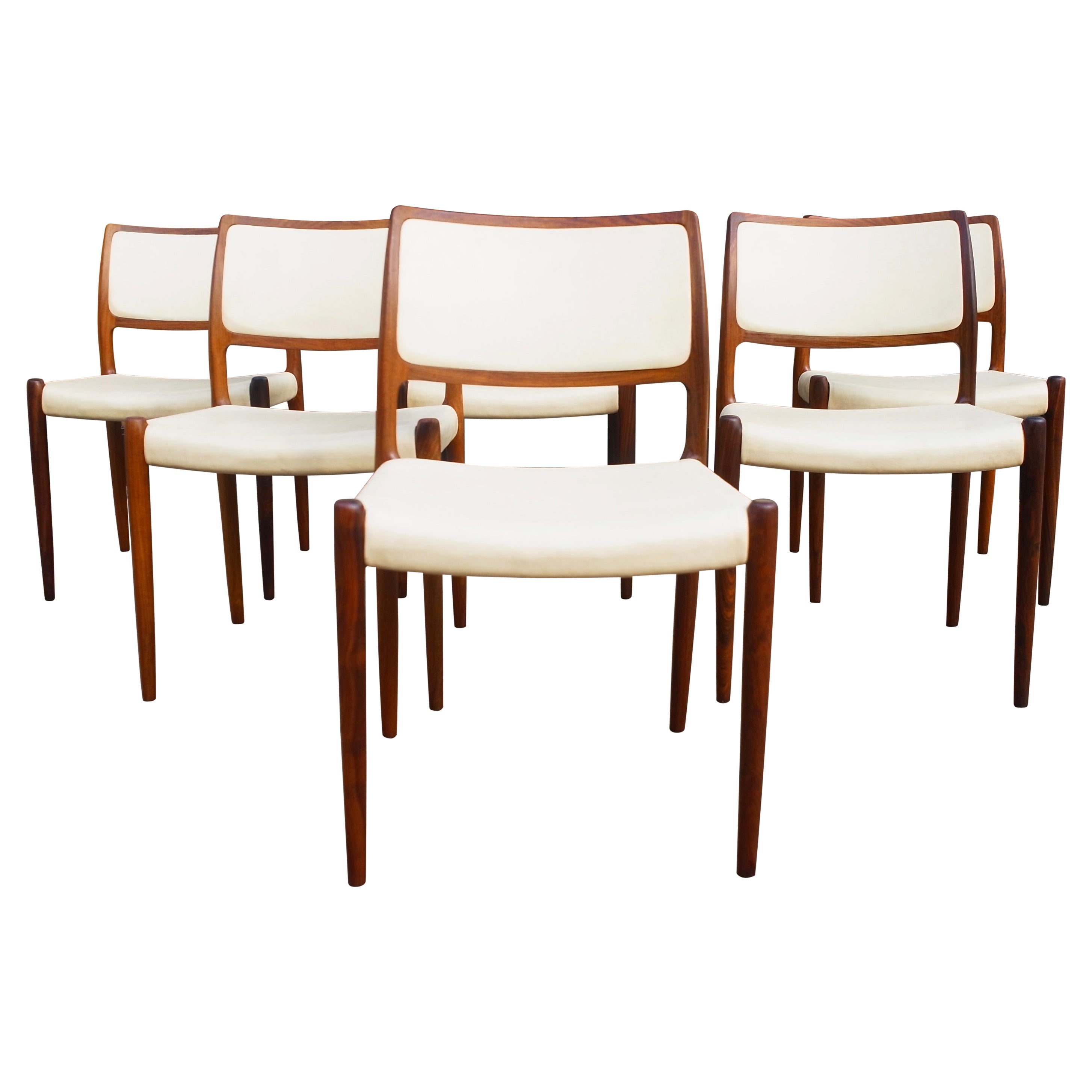 Six hardwood Niels Moller Model 80 Chairs, with cream vinyl upholstery  For Sale