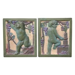 Antique Pair of Early 20th Century Polychrome Putti Architectural Tiles with Grape Motif