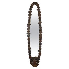 Wall Mirror with Iron Ore Pebble Border - early c20th & later pebbles