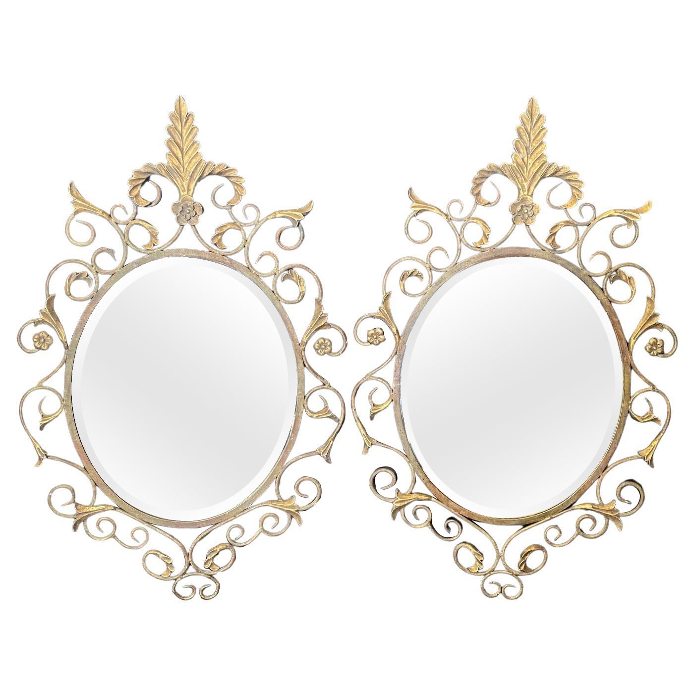 Pair of French Mid Century Fleur de Lis Scrolled Oval Beveled Wall Mirrors For Sale