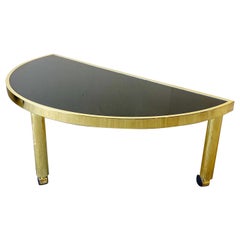 Hollywood Regency Gold Semicircular Coffee Table with Black Glass Top on Wheels