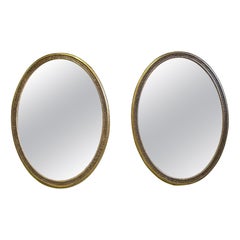 A pair of 6’6” 19th Century Country House Oval Mirrors