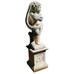 Large Old Weathered Statue of  a Cherub or Putti Set on a Plinth  