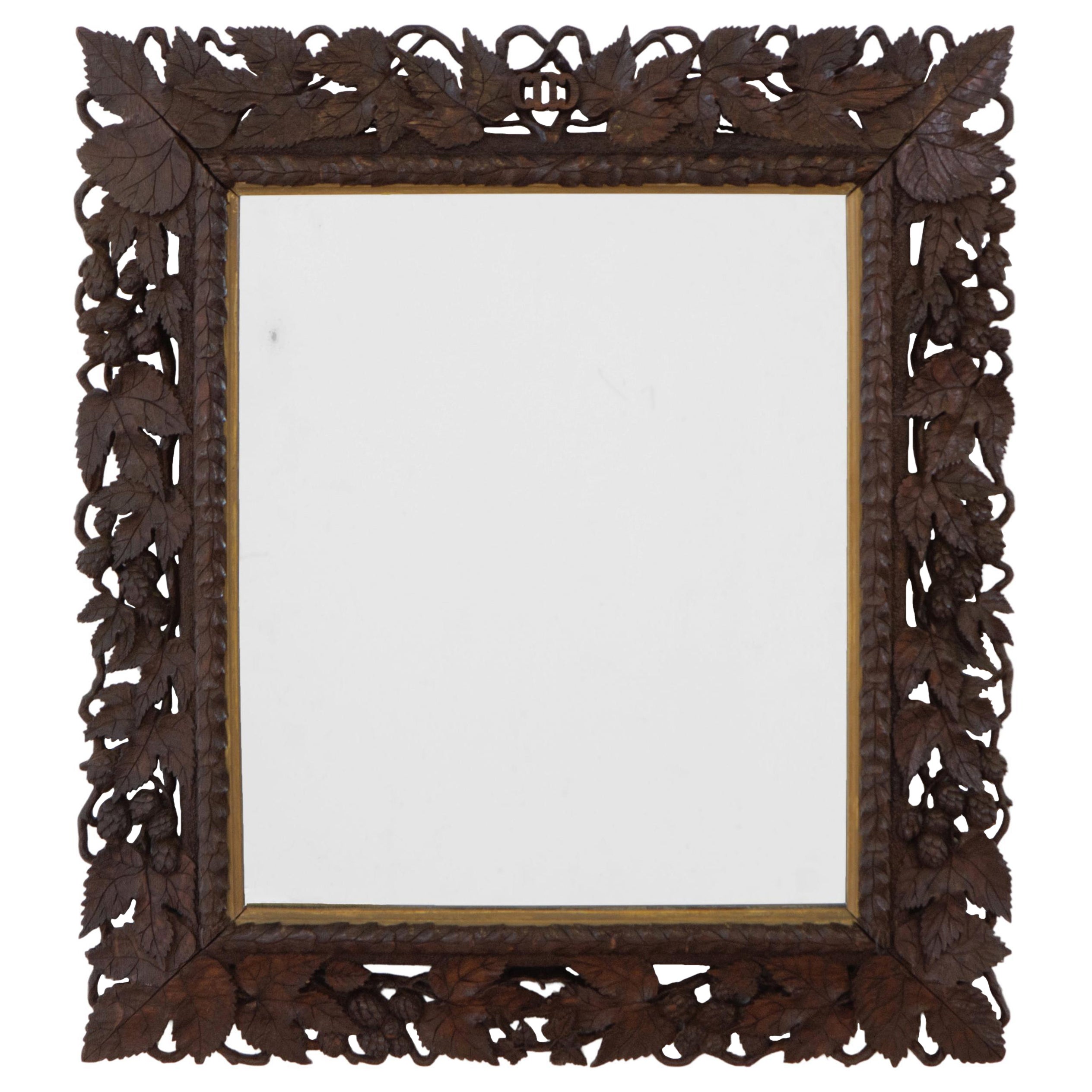 Early 20th Century Hand Carved And Giltwood Black Forest Oak Wall Mirror  For Sale