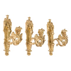 Set of 3 ornate gilt bronze curtain hooks in the Louis XV style