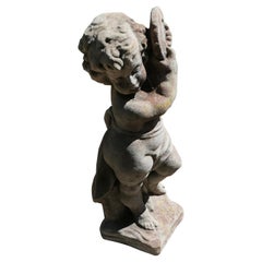 Old Weathered Statue of a Putti Playing Tambourine   