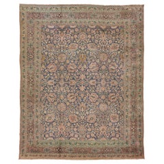 Tapis persan ancien en laine bleue de Tabriz des années 1920 avec motif floral sur toute sa surface