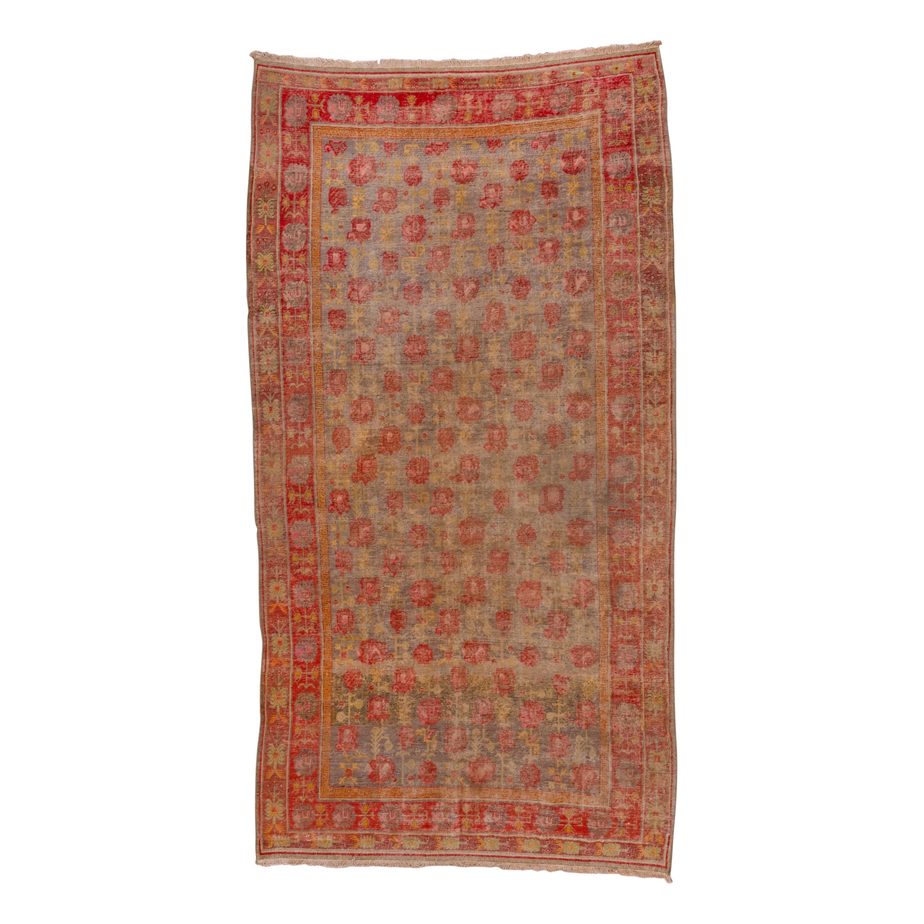 Colorful Antique Khotan Gallery Rug with Tones of Light Purple, Red and Mustard For Sale