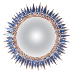 Blue glass and resin concave mirror in the manner of Line Vautrin.