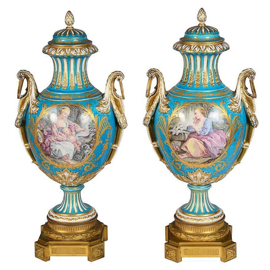 Pair 19th Century classical Sevres style lidded vases.