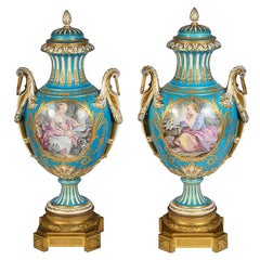 Antique Pair 19th Century classical Sevres style lidded vases.