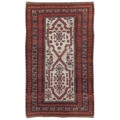 Tapis d'accent tribal baloutche persan fait à la main au milieu du 20e siècle