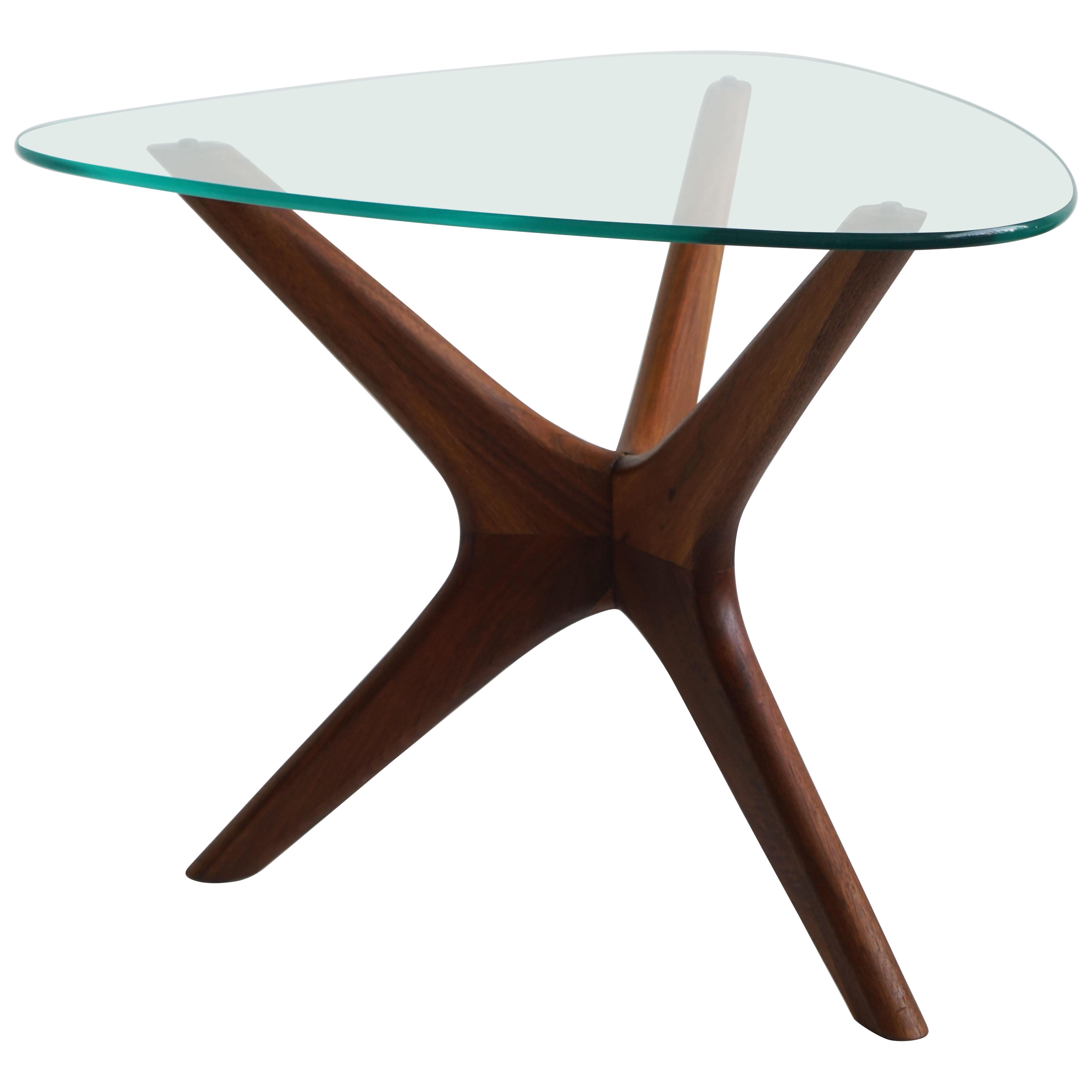 Organic modern sculptural side table with glass top, walnut base