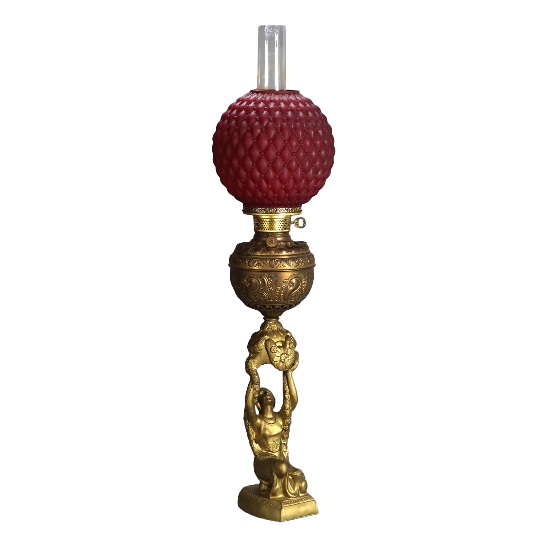 Antique Figural Gilt Metal Parlor Lamp with Quilted Red Glass Shade Circa 1900 For Sale