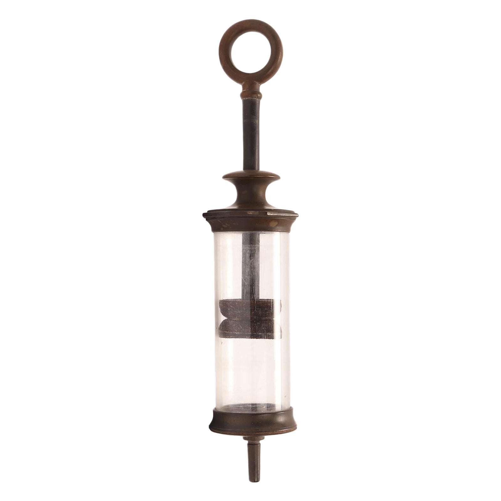 A glass and vulcanite syringe, London 1880.  For Sale