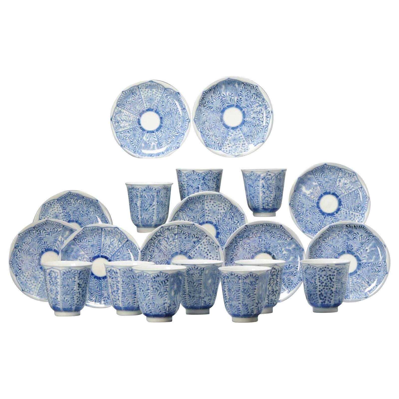 Juego de platos y tazones de té antiguos de porcelana japonesa azul y blanca Zoshuntei Sanpo en venta
